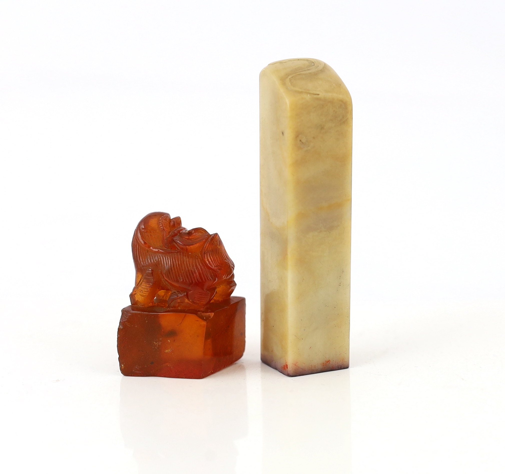 A 19th century Chinese amber ‘lion-dog’ seal and a 20th century soapstone seal